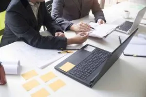 Construction team discussing plans and estimates